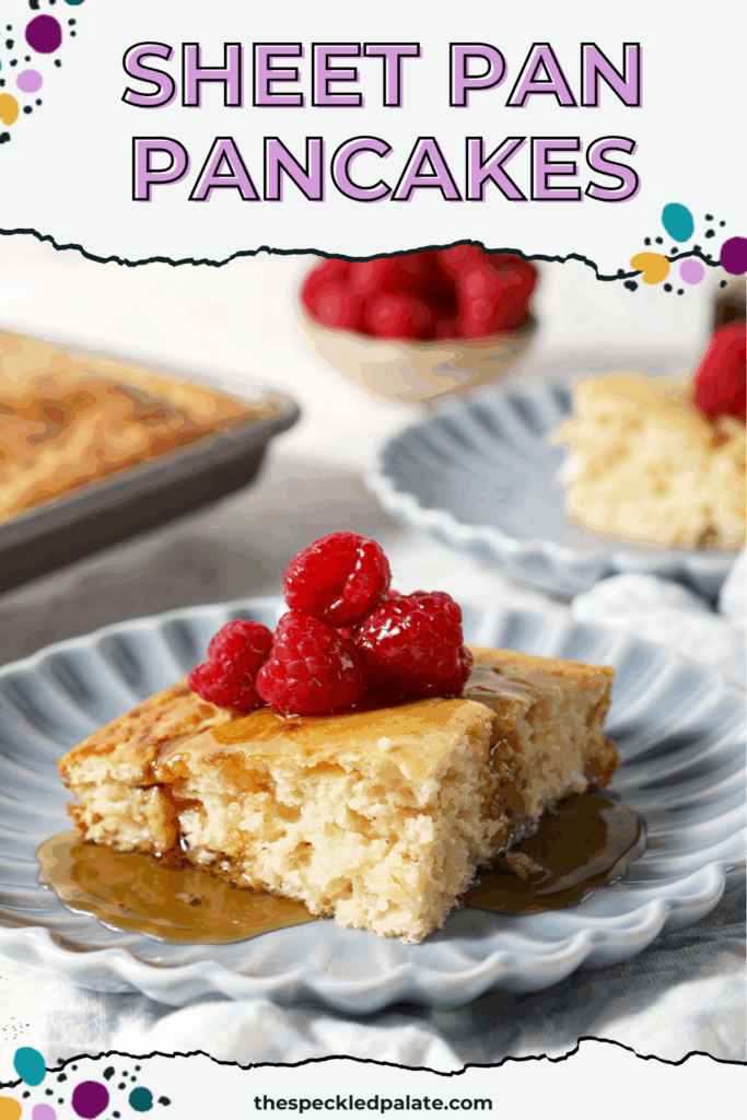 A square pancake on a blue plate topped with fresh raspberries and syrup with the text sheet pan pancakes