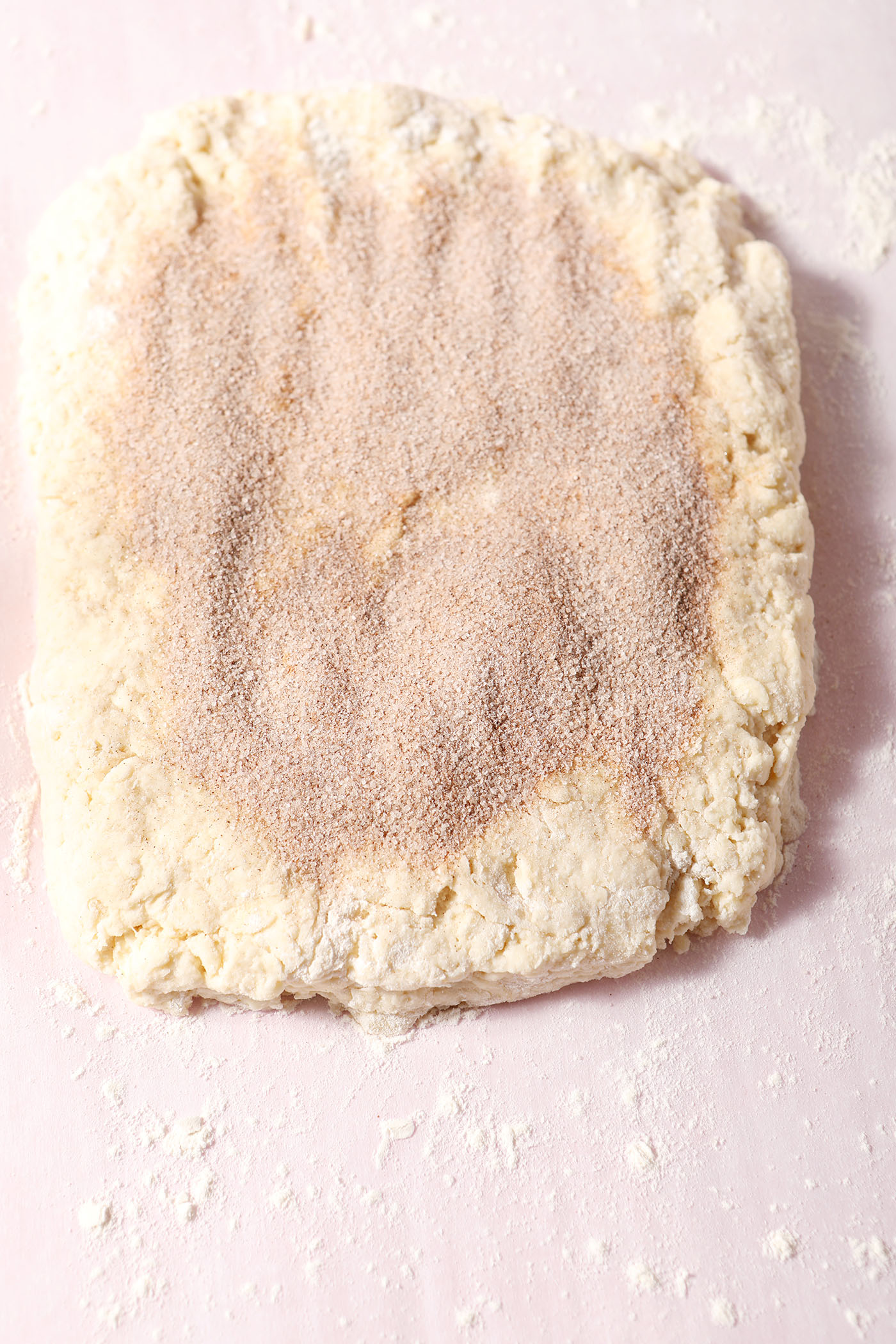 Cinnamon-sugar on top of biscuit dough