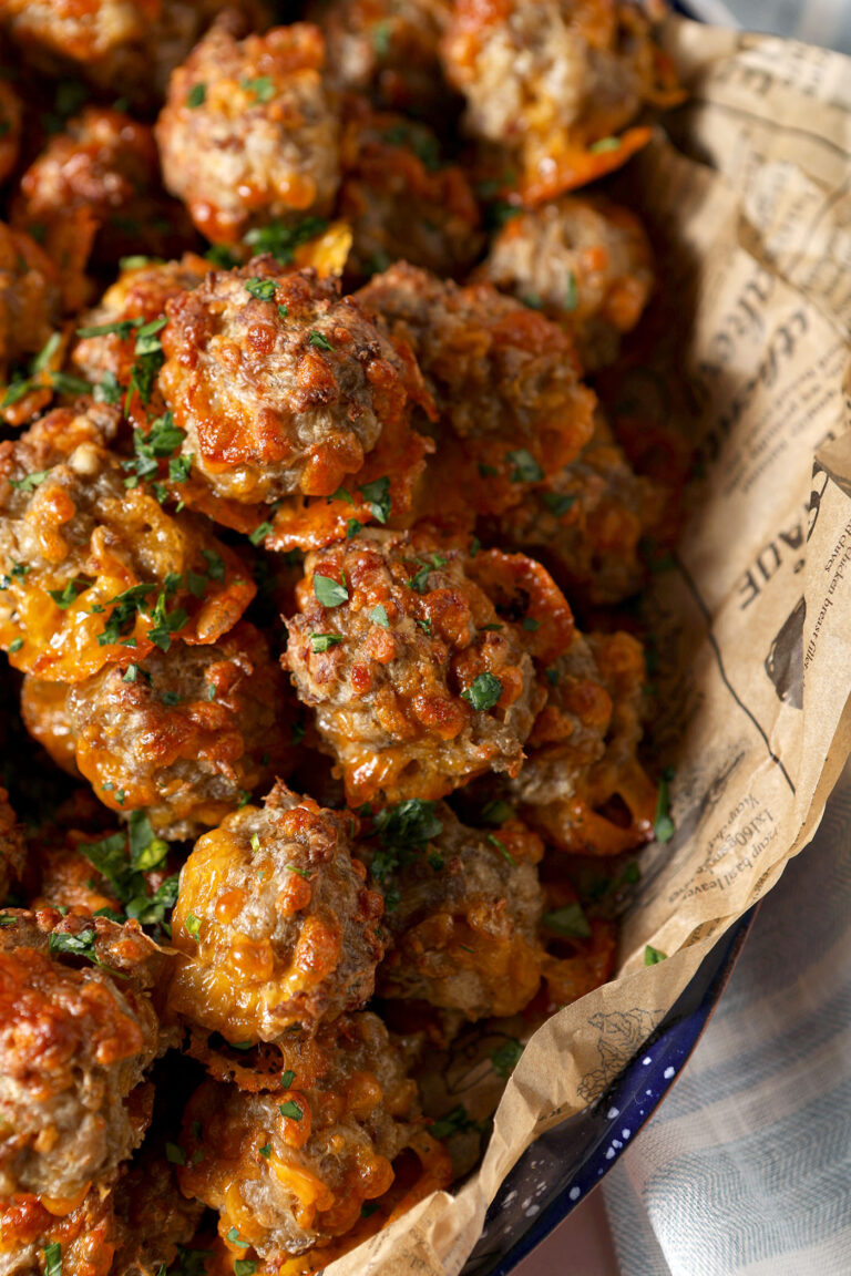 Close up of cream cheese sausage balls garnished with chopped parsley