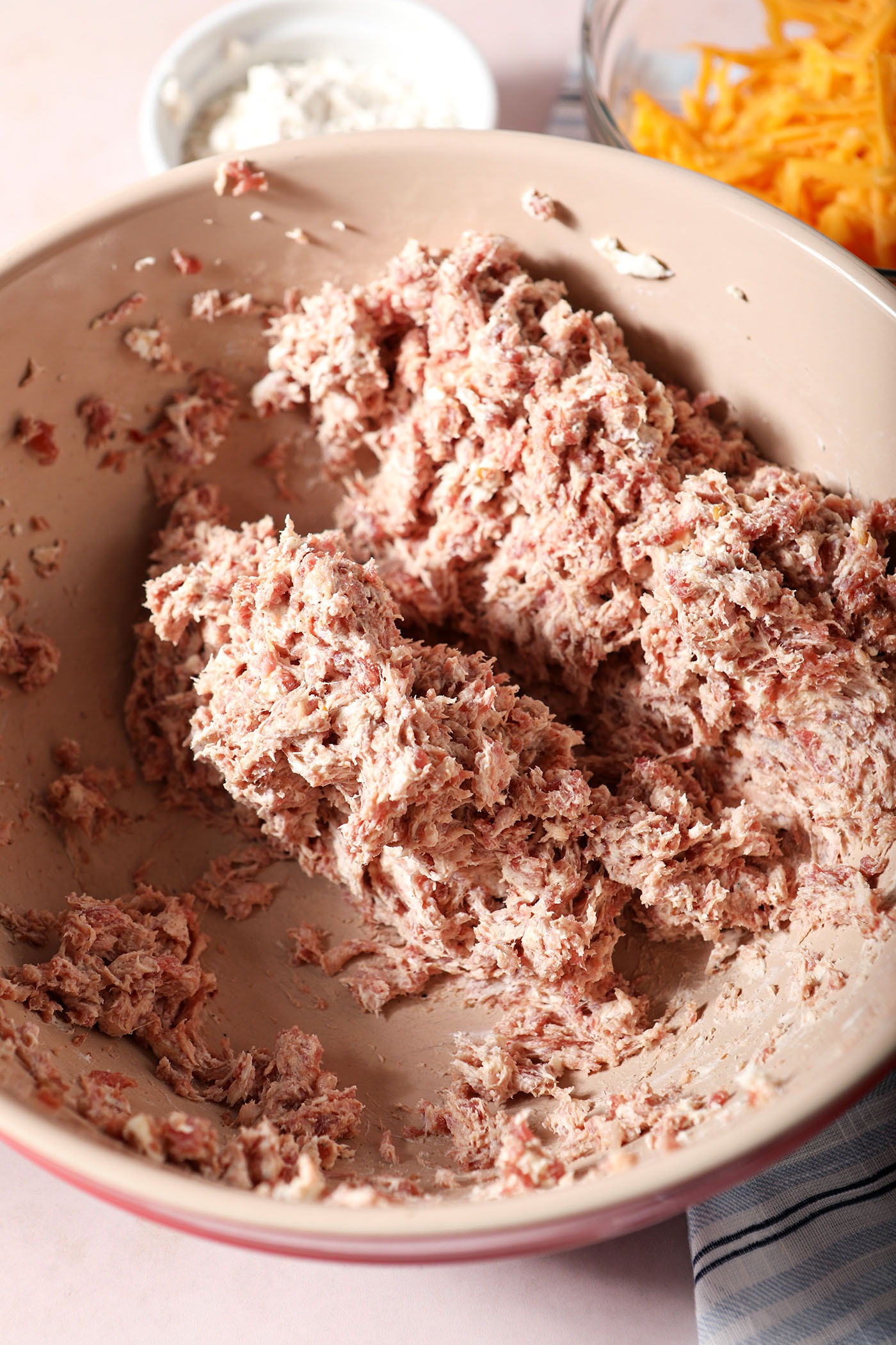 Blended cream cheese and sausage in a bowl