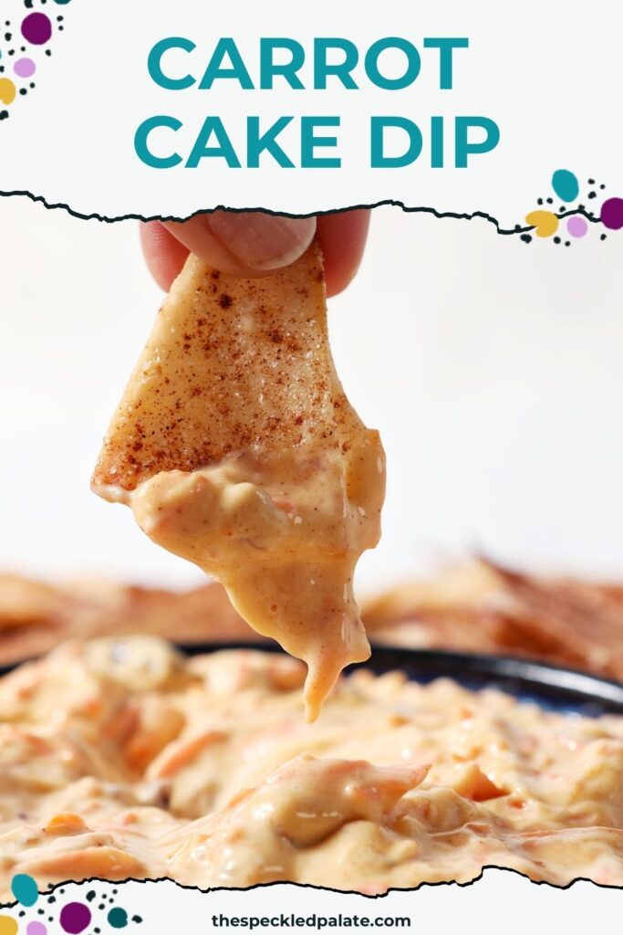 Close up of a hand dipping a chip into carrot cake dip with the text carrot cake dip