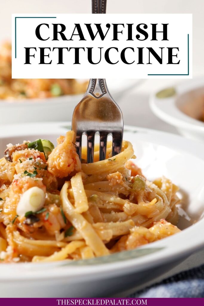 A fork swirls into a bowl of crawfish pasta with the text crawfish fettuccine