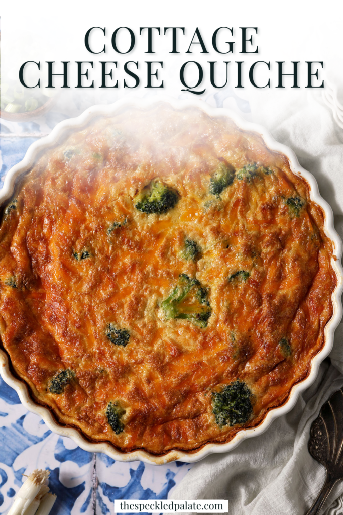 Overhead of a Crustless Cottage Cheese Quiche on a blue and white tiled surface surrounded by green onions with the text cottage cheese quiche