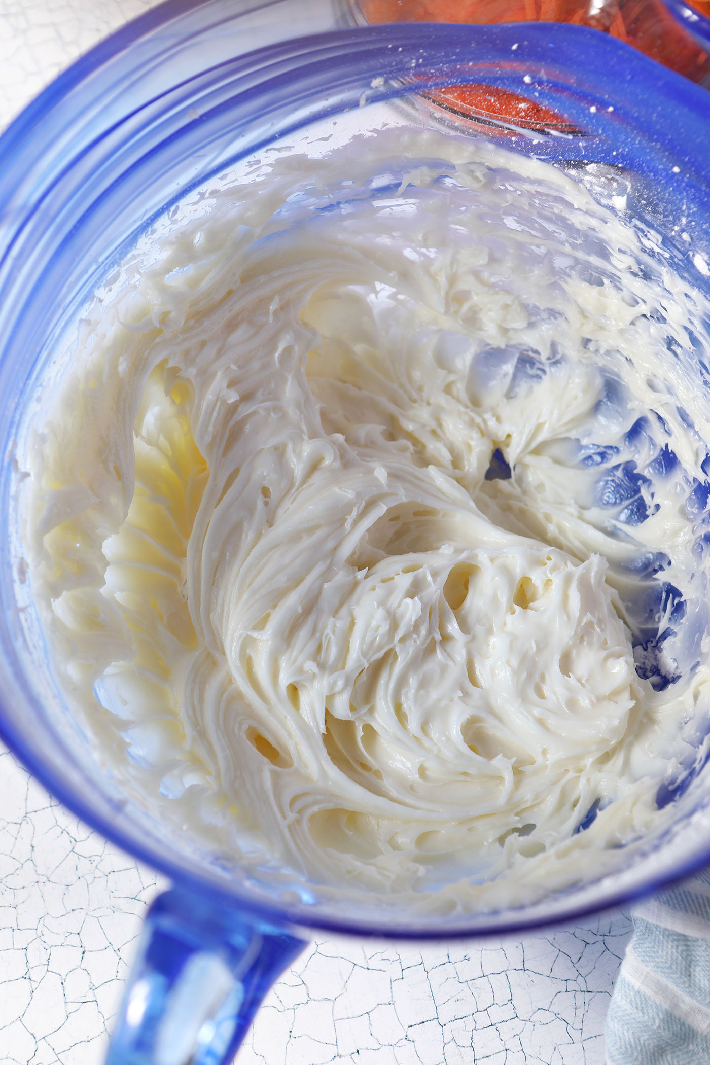 Whipped cream cheese in a blue bowl