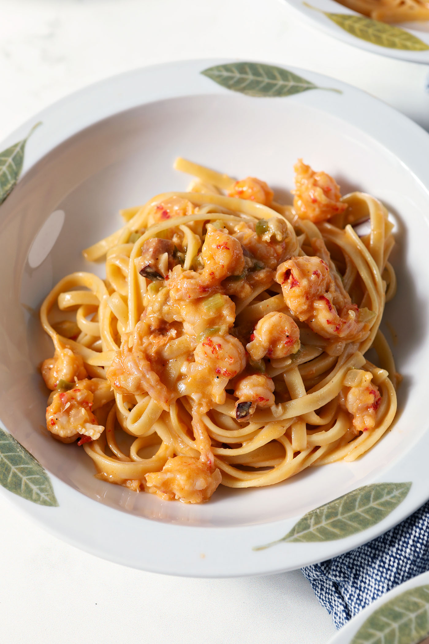 Overhead of a bowl of crawfish fettuccine before garnishes are added