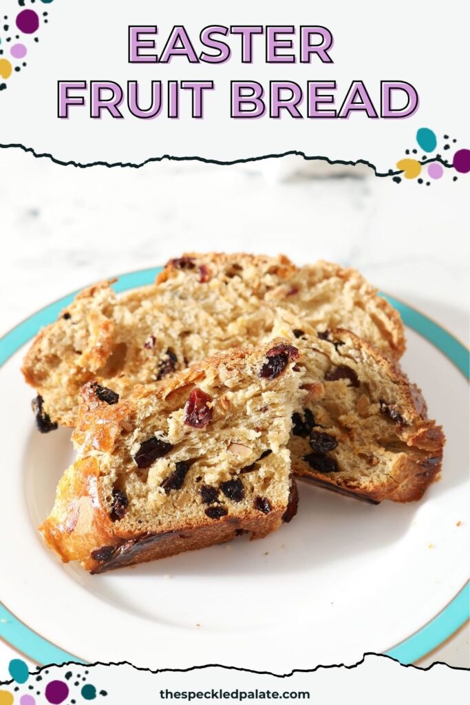 Close up of sliced easter bread on a white plate with a turquoise rim with the text easter fruit bread