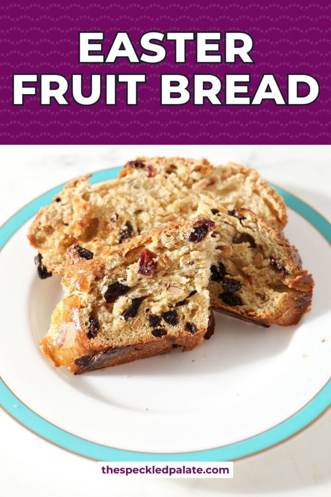 Close up of sliced easter bread on a white plate with a turquoise rim with the text easter fruit bread