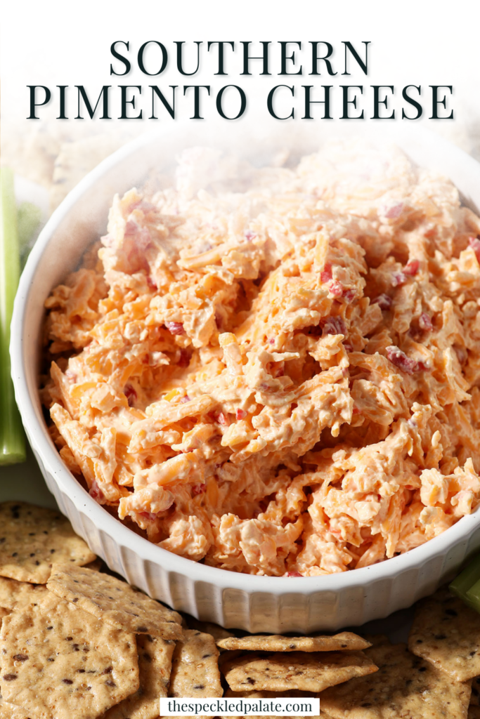 A white bowl holding pimento cheese surrounded by crackers and celery sticks with the text southern pimento cheese