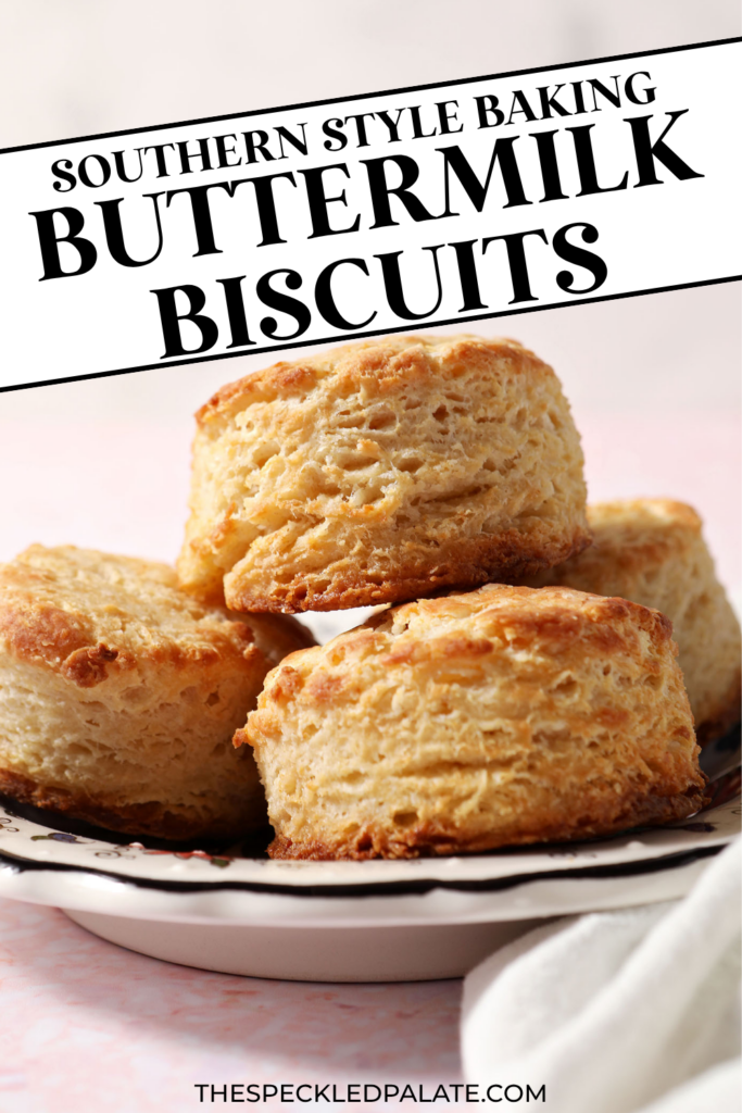 A plate of buttermilk biscuits stacked on a plate on a pink surface with the text southern style baking buttermilk biscuits