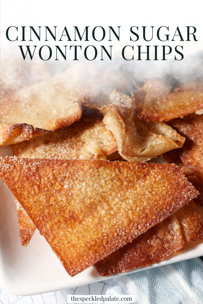 Closeup of a triangular wonton chip on a platter next to a dessert dip with the text cinnamon sugar wonton chips