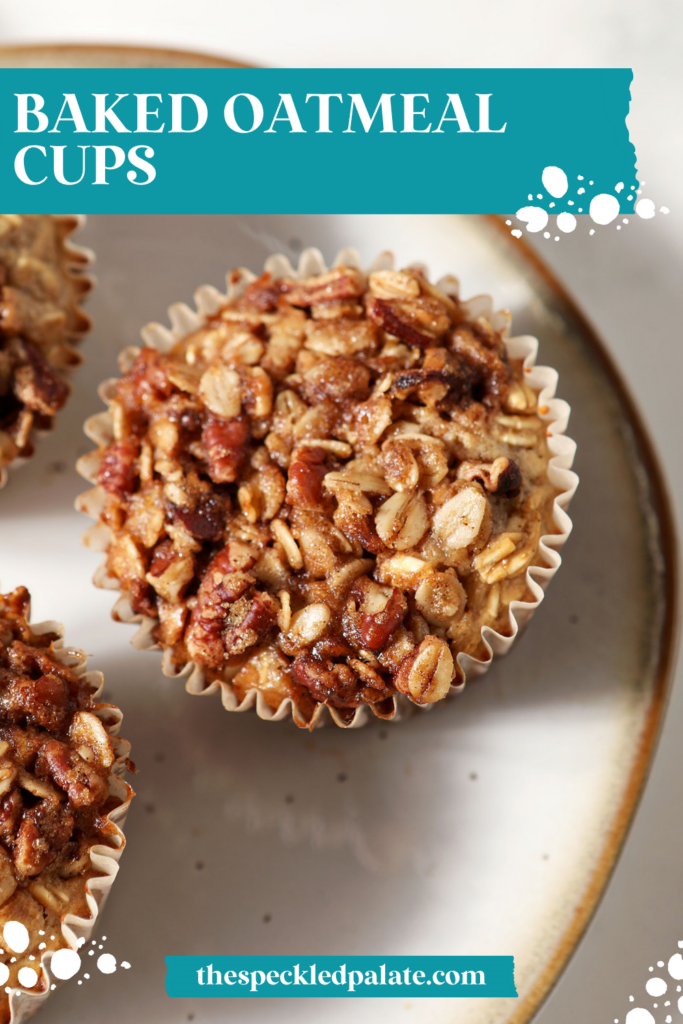 Closeup of a baked oatmeal cup on a plate from above with two more
