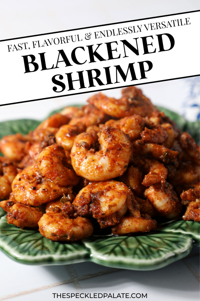 Blackened shrimp piled high on a green plate with text "Blackened Shrimp"