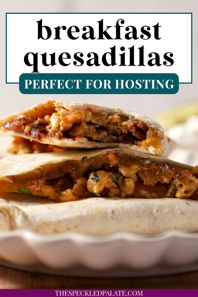 Breakfast quesadillas stacked on a plate on top of a wooden cutting board next to bowls of salsa and sour cream and an avocado. With the Text "Breakfast Quesadillas. Perfect for Hosting." written across the top.