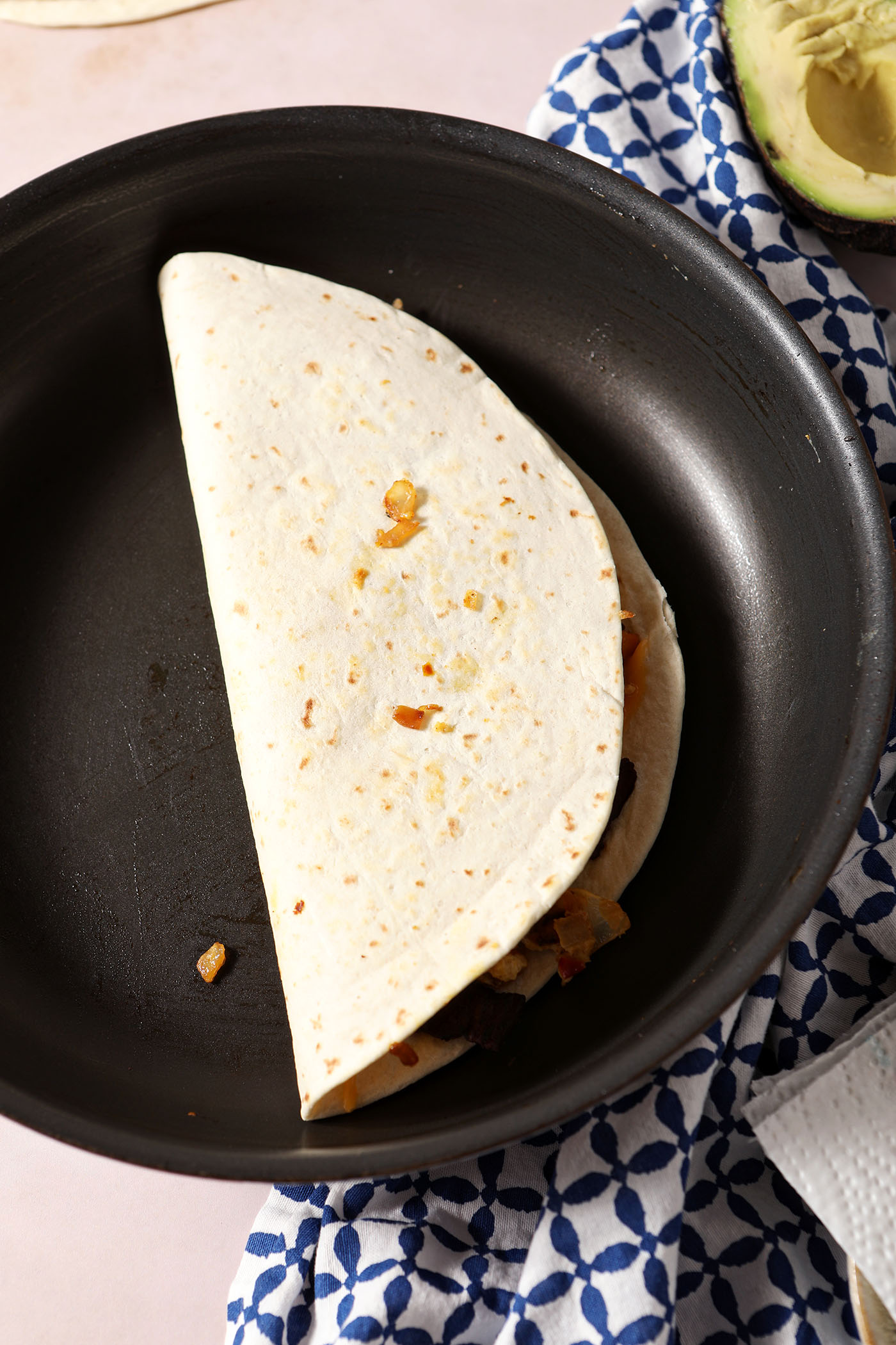 A quesadilla in a non-stick skillet