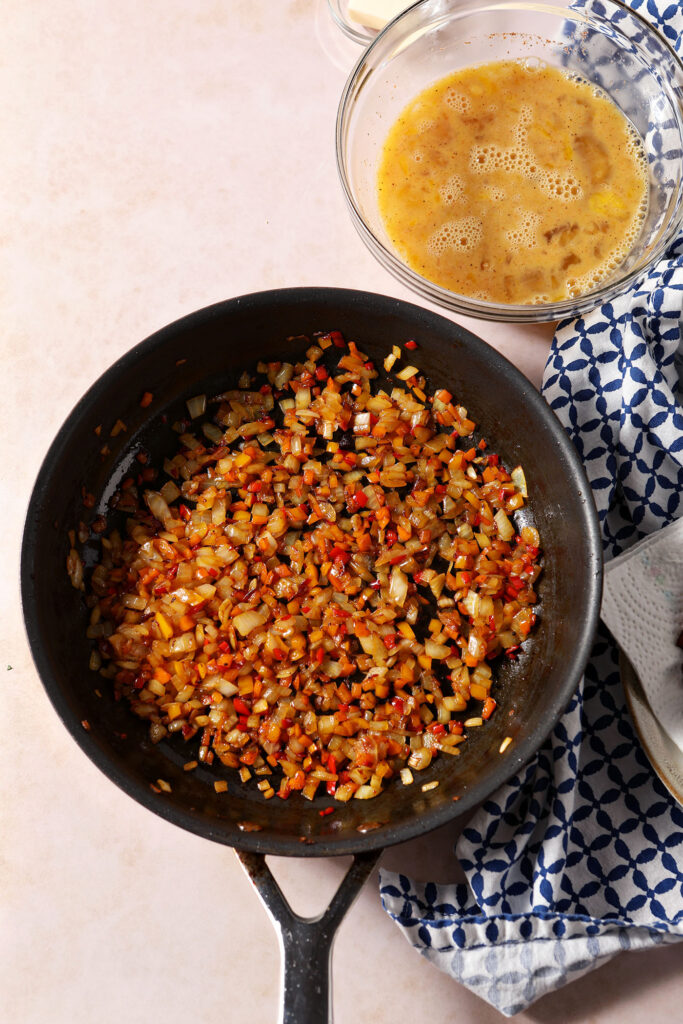 Diced peppers and onion in a skillet after cooking