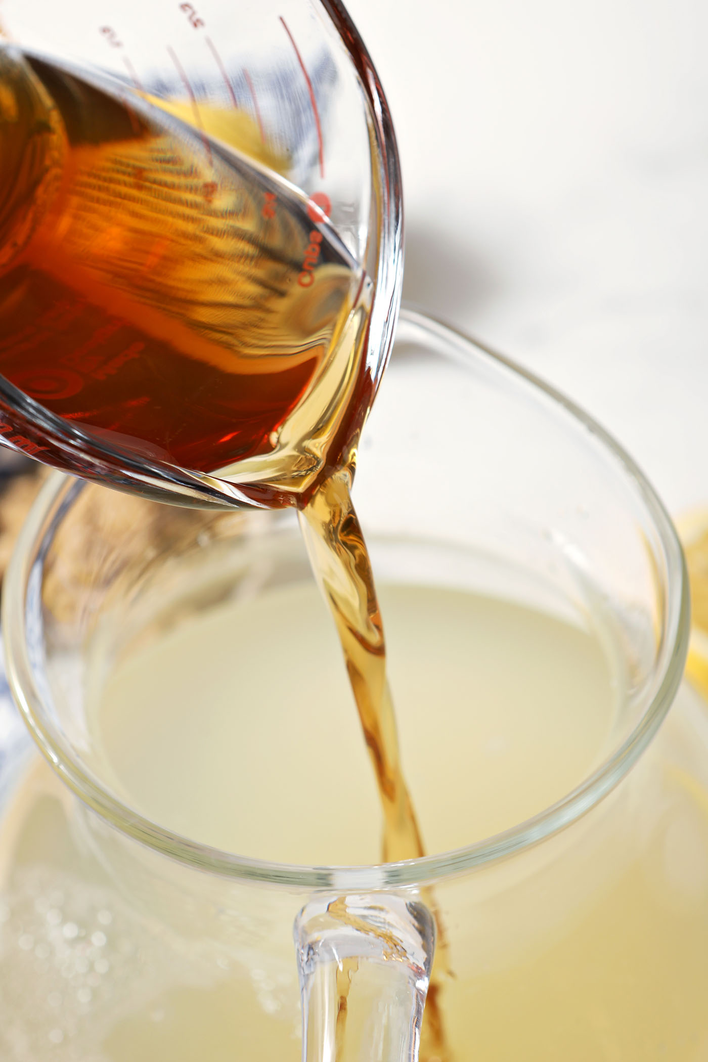 Brown sugar syrup pours into a pitcher