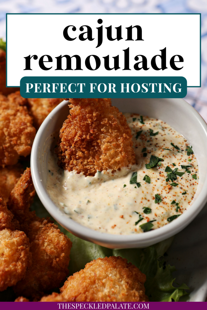 a plate of fried shrimp surrounding the cajun remoulade sauce cup with a shrimp dipped into the cajun remoulade sauce. With text at the top saying "Cajun Remoulade"