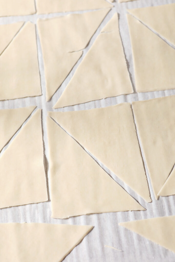 Triangular wontons on a sheet pan