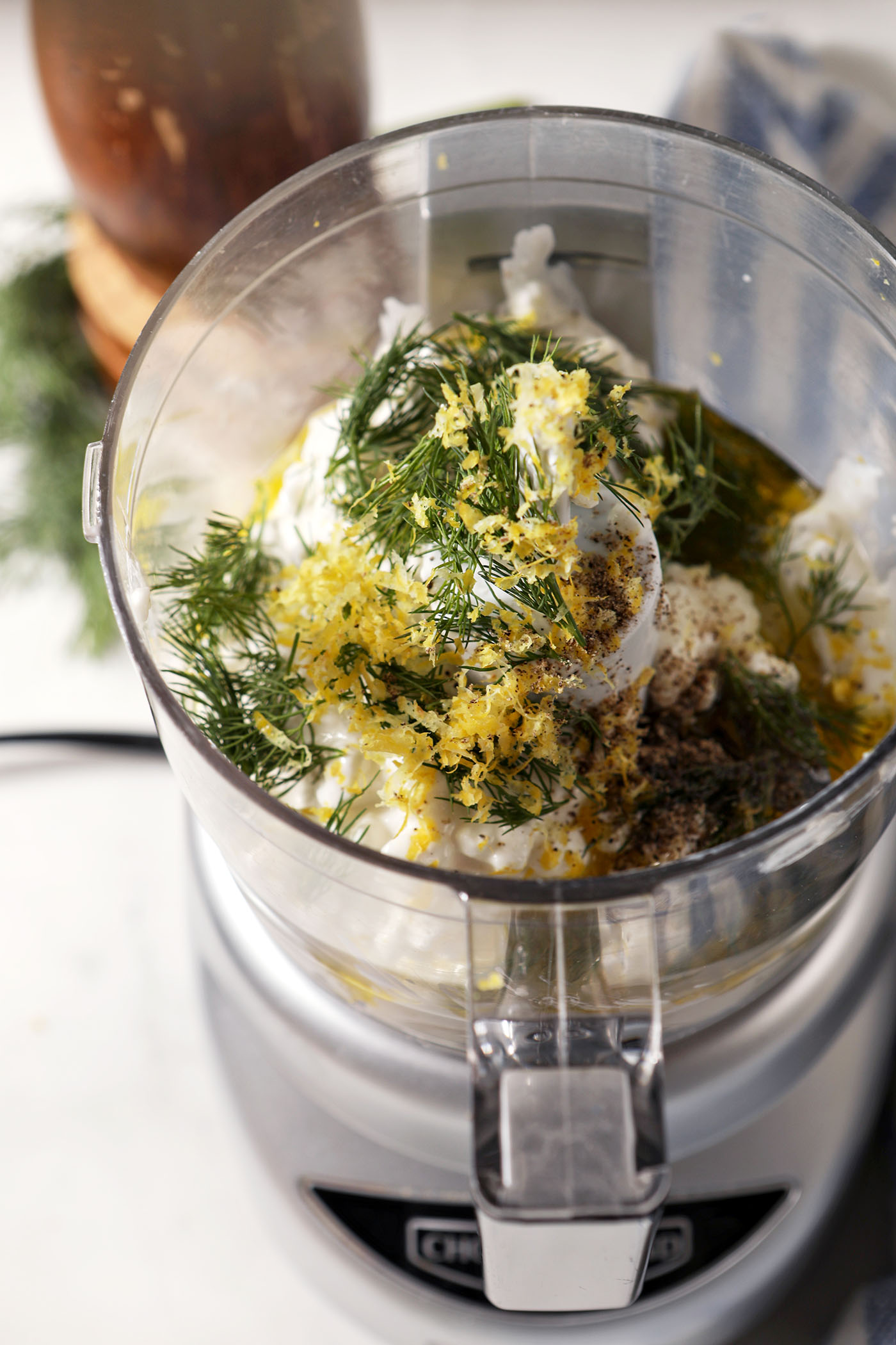 Ingredients to make dip with cottage cheese in a food processor, before blending