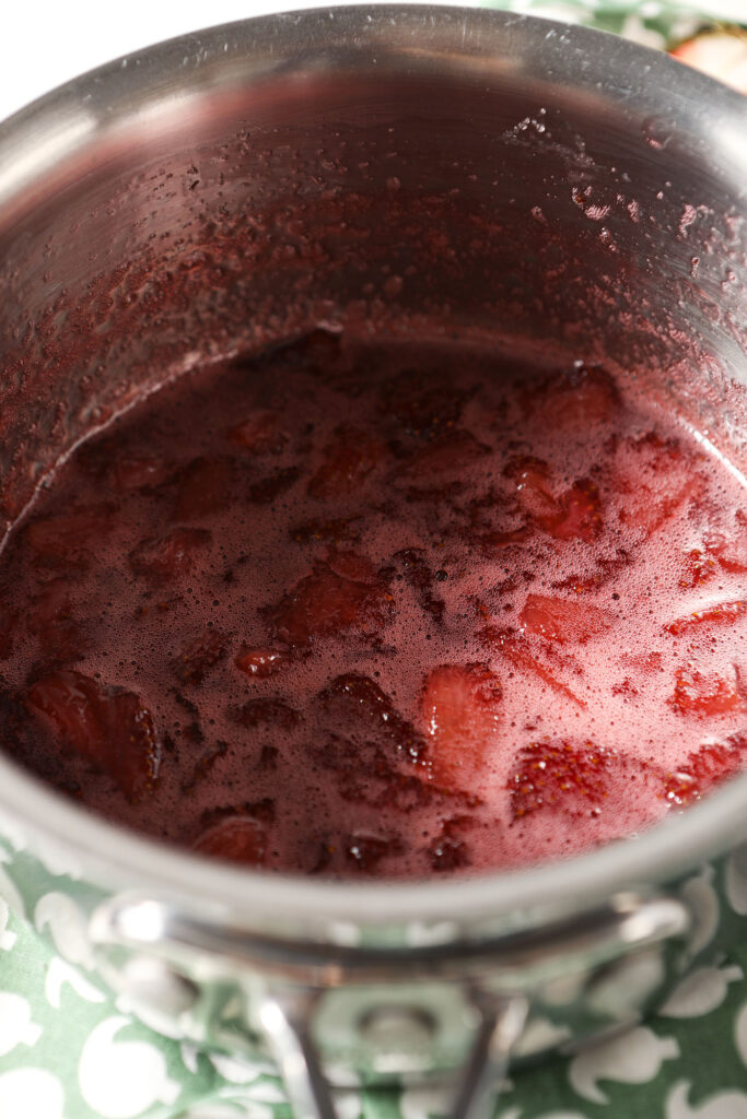 Cooked down strawberries and sugar in a saucepan