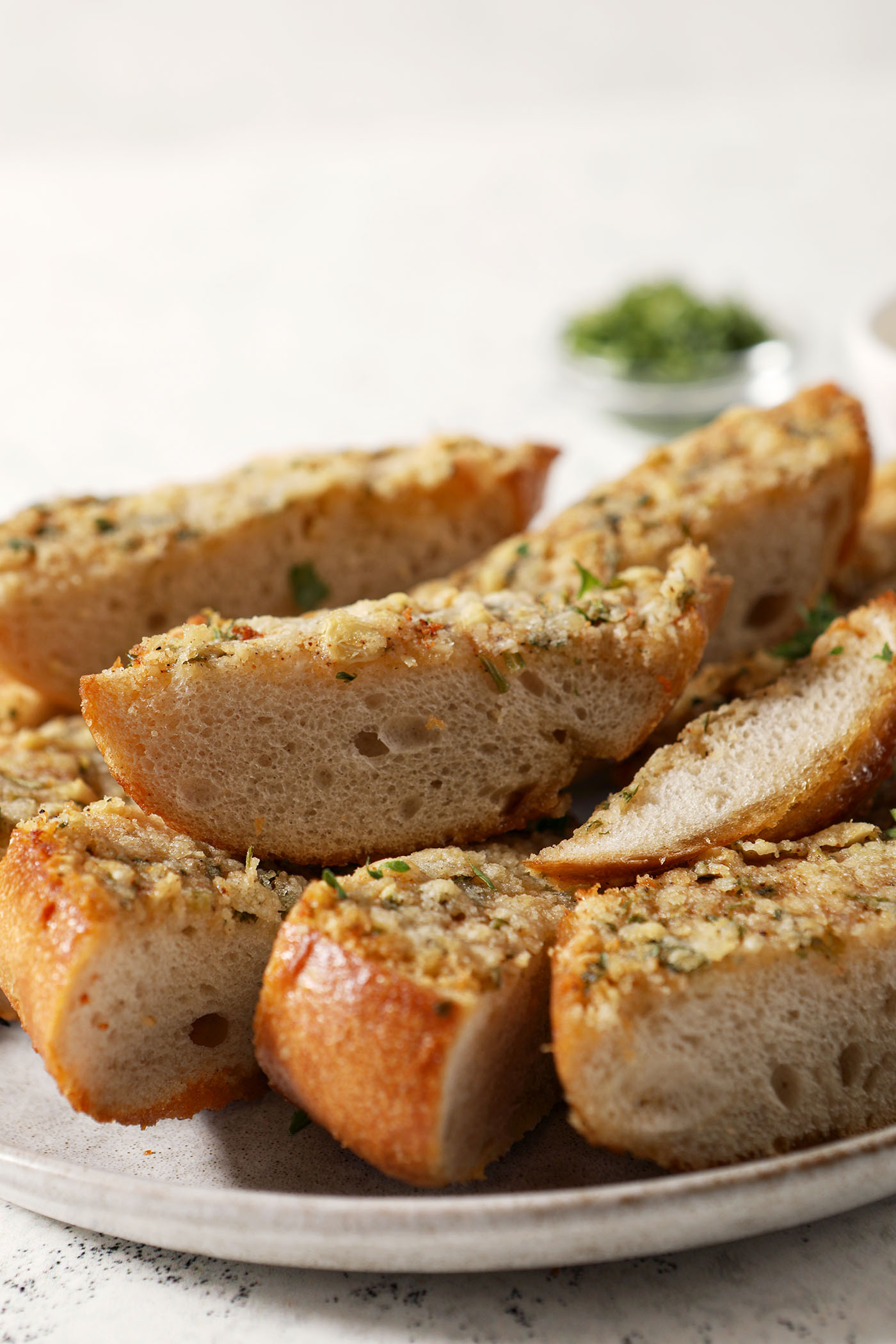 A platter of Cajun garlic bread on a surface for serving