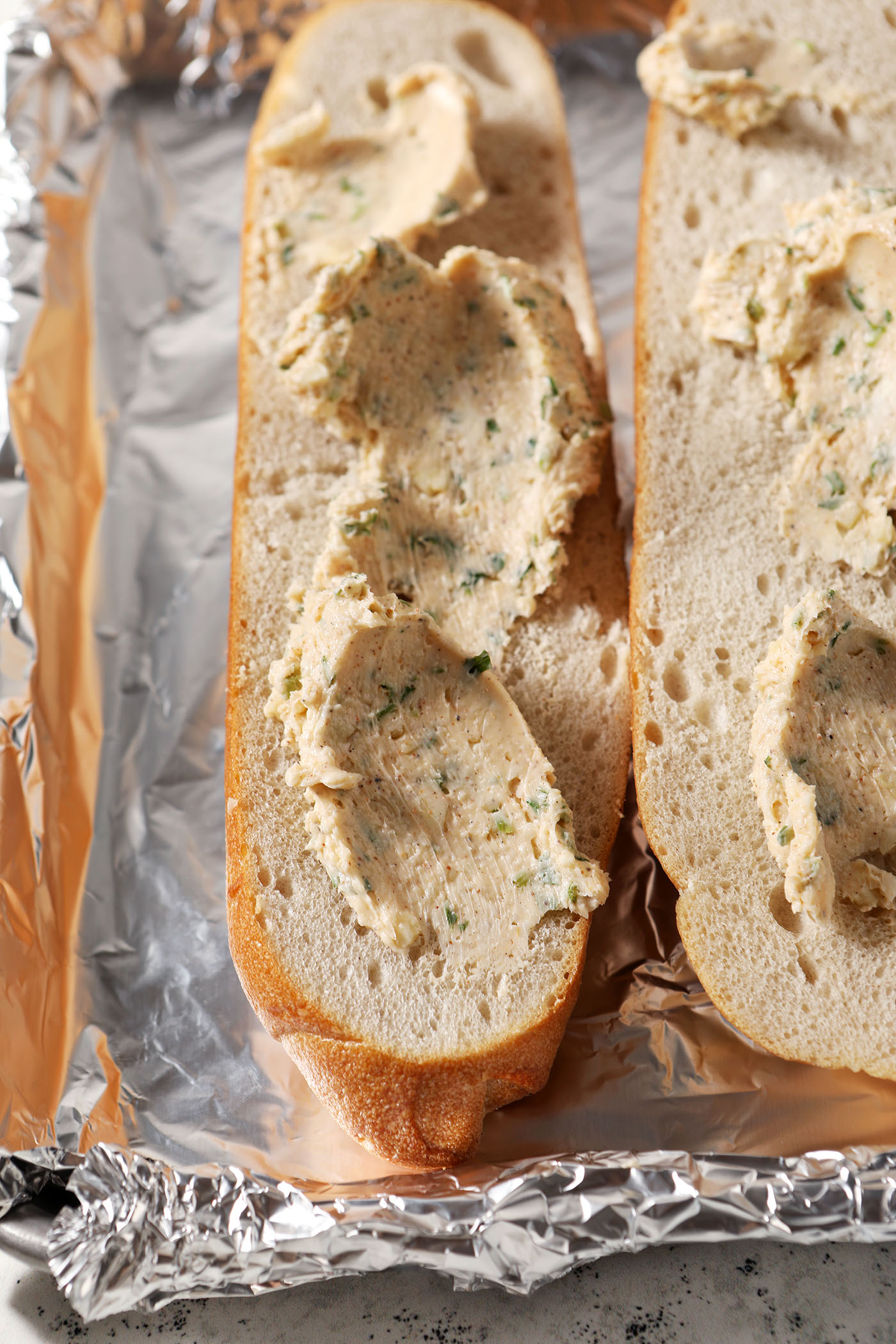 Cajun garlic butter smeared on a halved loaf of bread