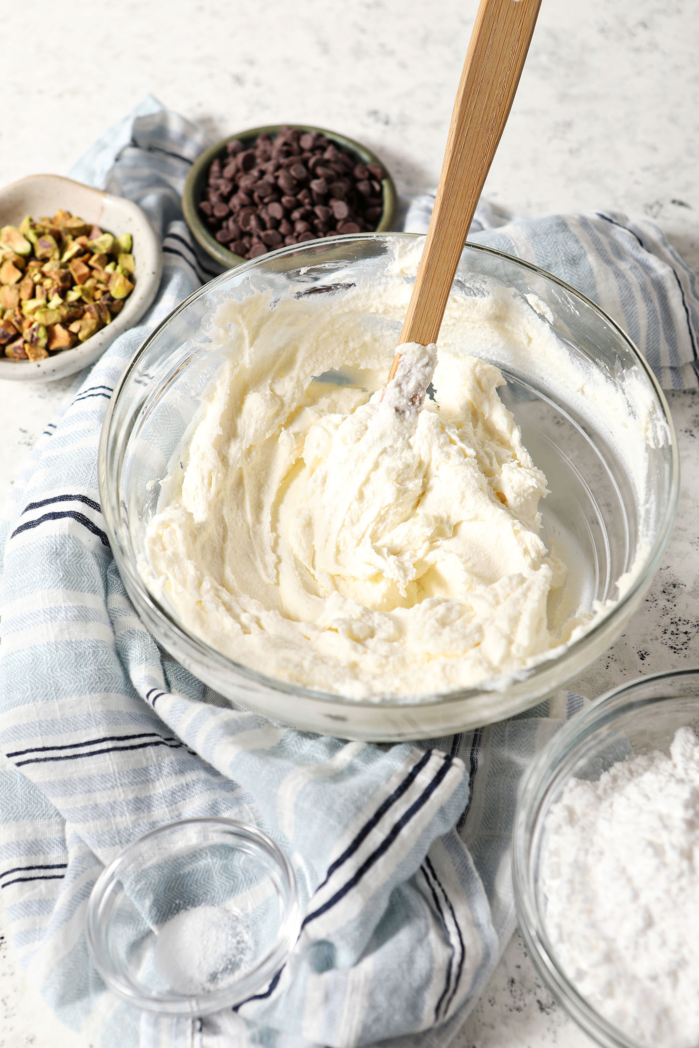 Combine sweet cheeses in a bowl with a rubber spatula before other ingredients are added to the dip