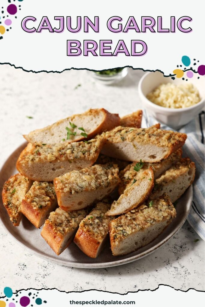 A gray ceramic plate full of cajun cheesy garlic bread with a small ceramic bowl of cheese behind it.