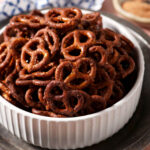Close-up of Cajun pretzels in a white bowl on a silver tray