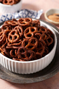 Close-up of Cajun pretzels in a white bowl on a silver tray