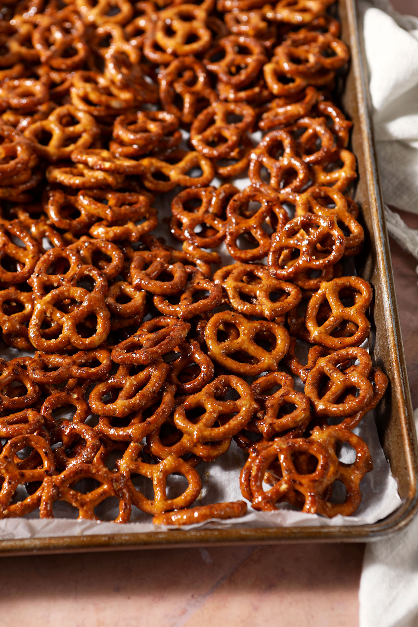 Cajun pretzels on a sheet pan lined with parchment before baking