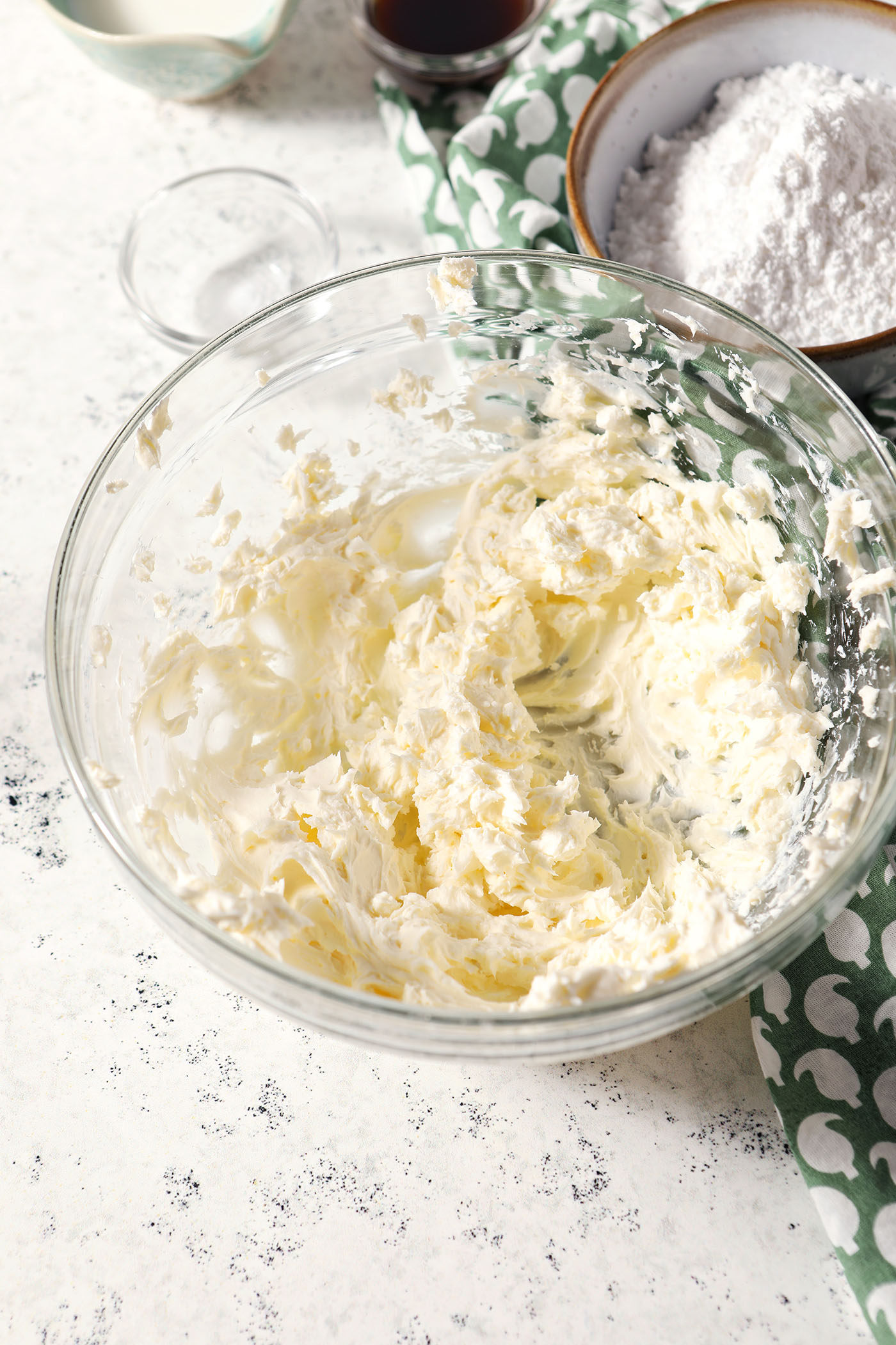 Whipped cream cheese and milk in a bowl