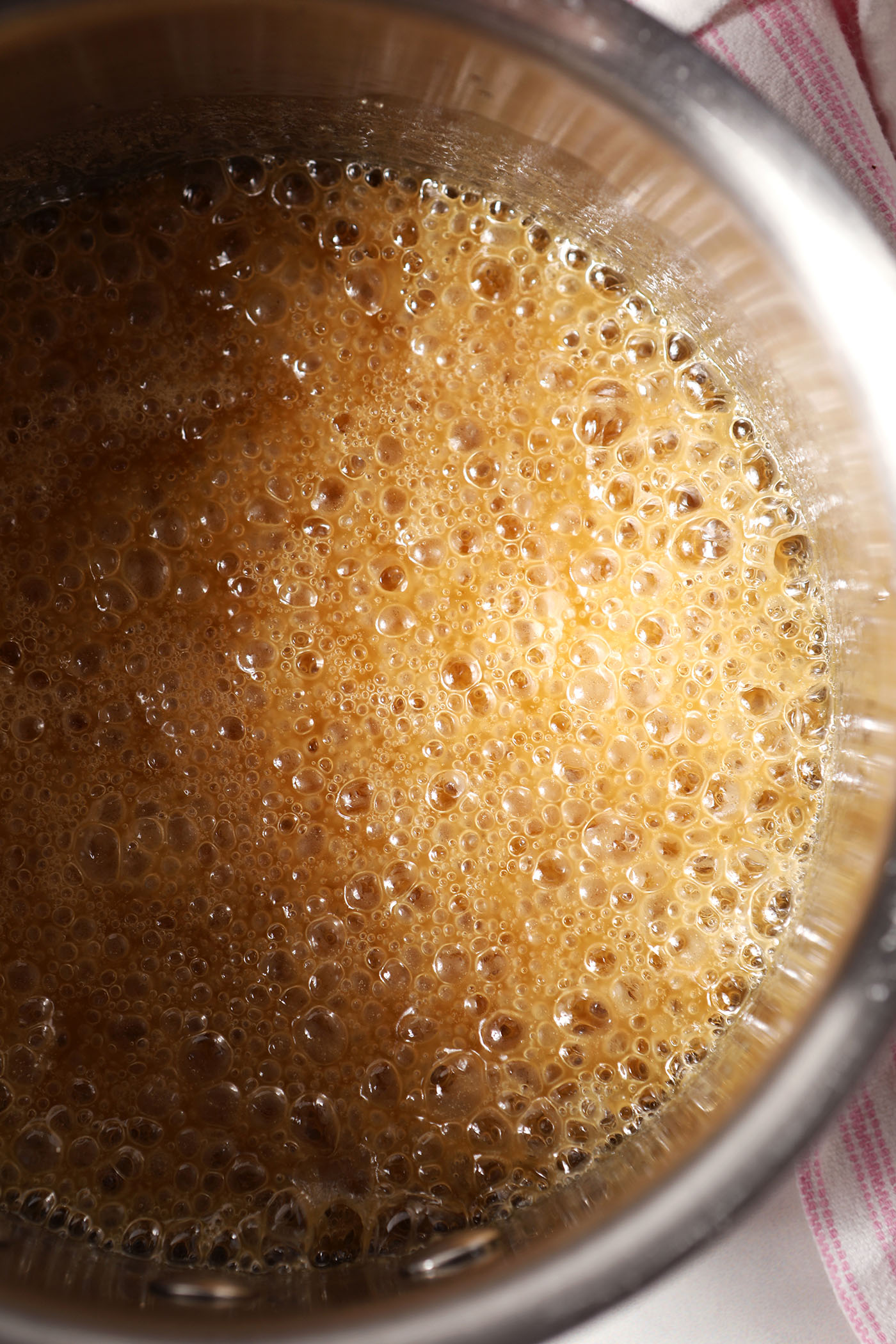 Bubbling butter toffee in a saucepan