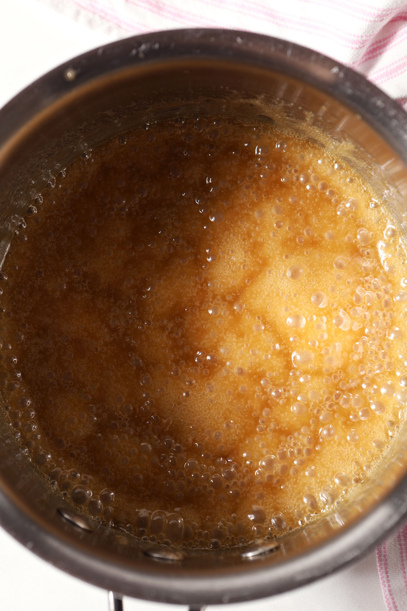 Butter toffee after vanilla is added in a saucepan