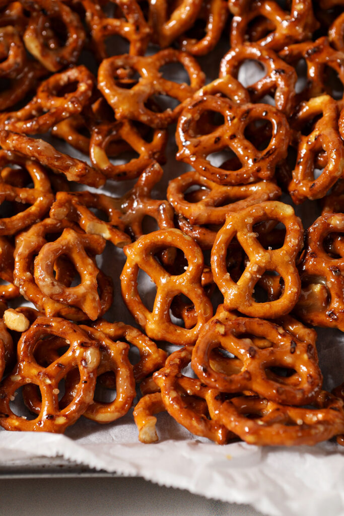 Close-up of Toffee Pretzels on a sheet pan halfway through baking