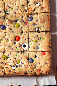 Sliced Halloween Cookie Bars on parchment paper